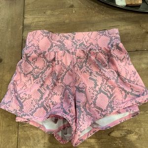 Ladies size small Fabletics, pink and gray snake Skin pattern shorts.